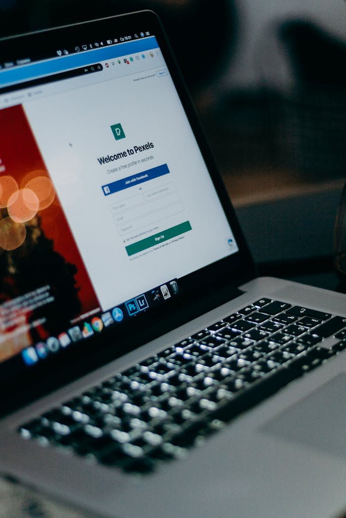 about-01 Close-up of a laptop showing the Pexels login interface with a blurred background, creating a moody tech scene.